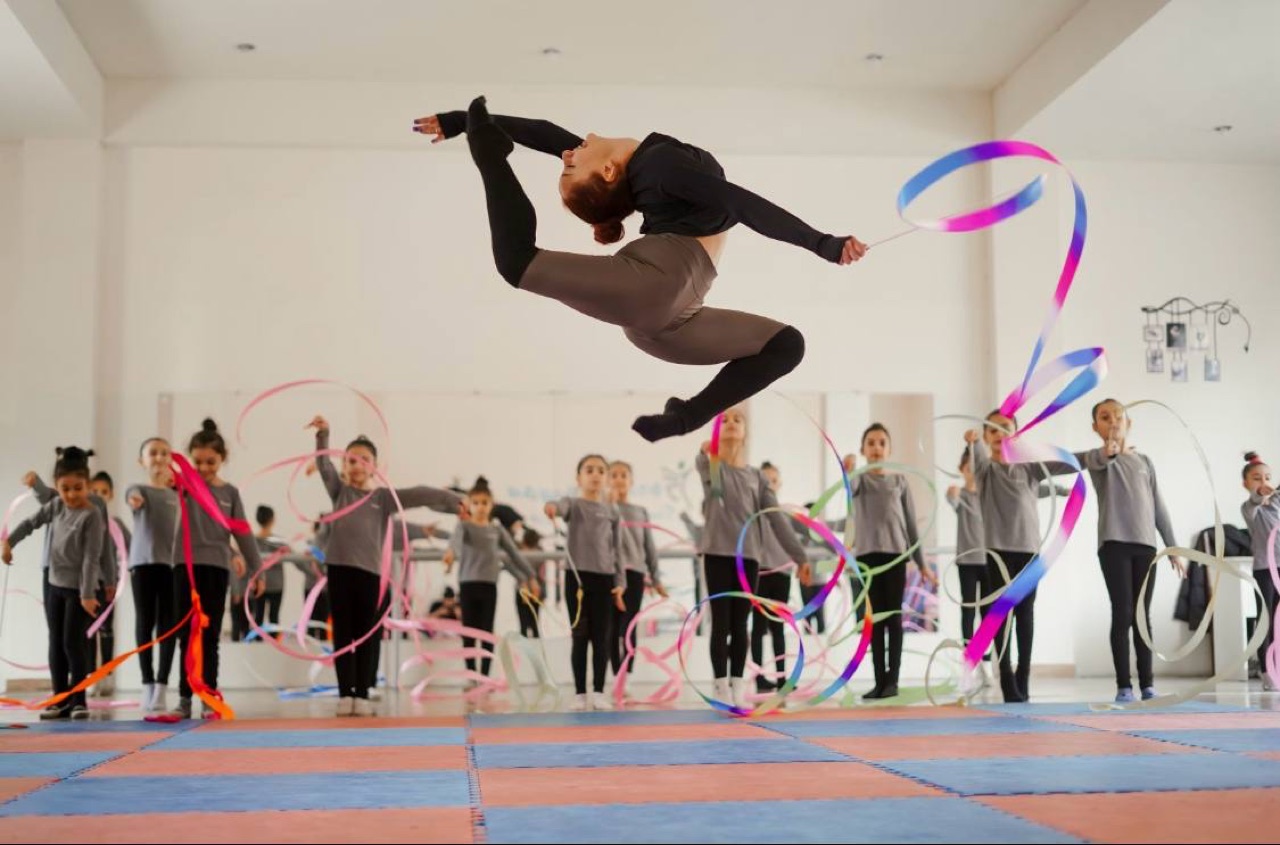 A young mover leaping mid-air during a class in Glendale